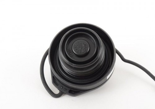 cap with retaining strap f